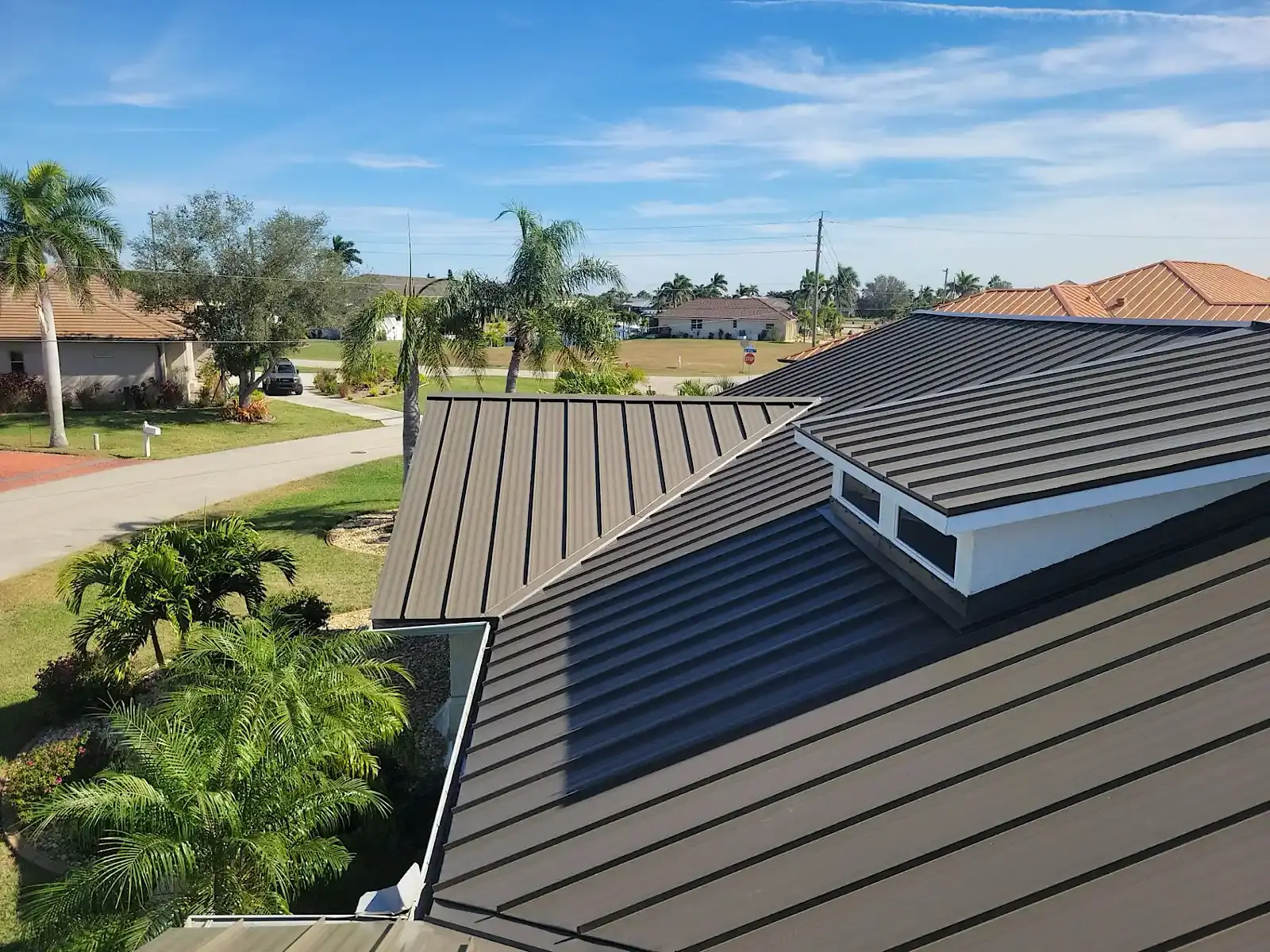 The same roof finished in bronze standing-seam metal