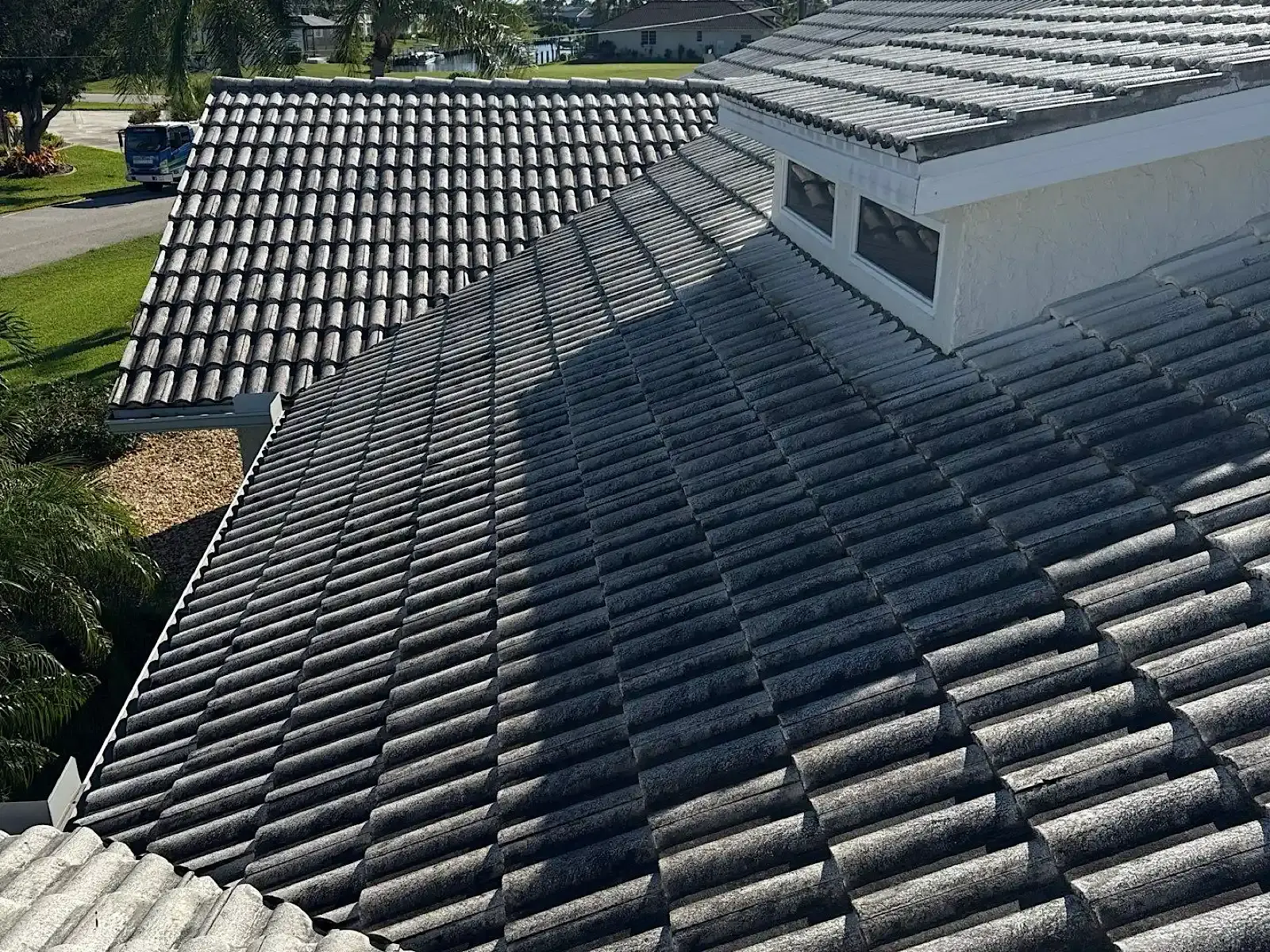 Weathered concrete tile roof before replacement, Punta Gorda, Florida